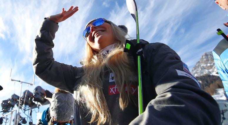 United States' Lindsey Vonn waves as she stands in the finish area after completing an alpine ski, women's World Cup super-G in Cortina D'Ampezzo, Italy, Sunday, Jan. 20, 2019. Lindsey Vonn