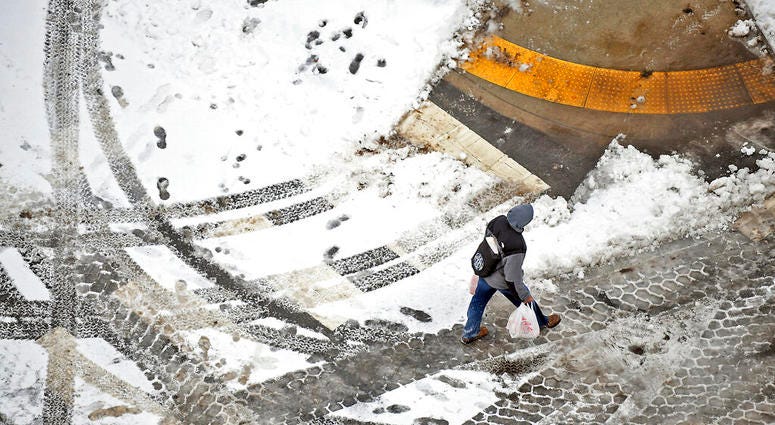 A pedestrian walks across the street in downtown Scranton, Pa., on Sunday, Jan. 20, 2019. A pedestrian walks across the street in downtown Scranton, Pa., on Sunday, Jan. 20, 2019.