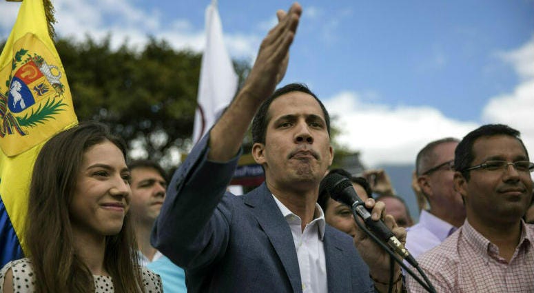 Venezuela's self-declared interim leader Juan Guaido, accompanied by his wife Fabiana Rosales, speaks to supporters during a gathering to propose amnesty laws for police and military, at a public plaza in Las Mercedes neighborhood of Caracas, Venezuela, S Venezuela's self-declared interim leader Juan Guaido, accompanied by his wife Fabiana Rosales, speaks to supporters during a gathering to propose amnesty laws for police and military, at a public plaza in Las Mercedes neighborhood of Caracas, Venezuela, S