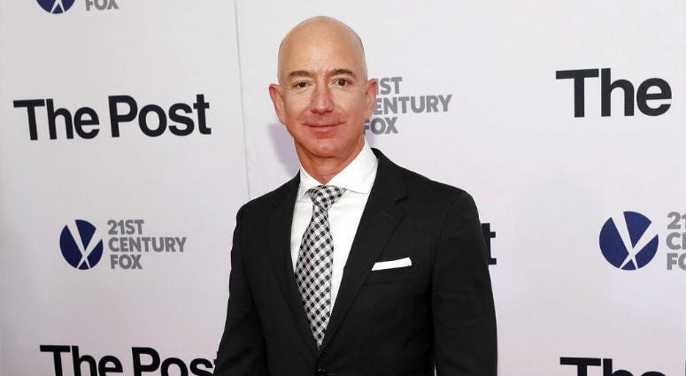 FILE - In this Dec. 14, 2017, file photo, Jeff Bezos attends the premiere of "The Post" at The Newseum in Washington. FILE - In this Dec. 14, 2017, file photo, Jeff Bezos attends the premiere of "The Post" at The Newseum in Washington.