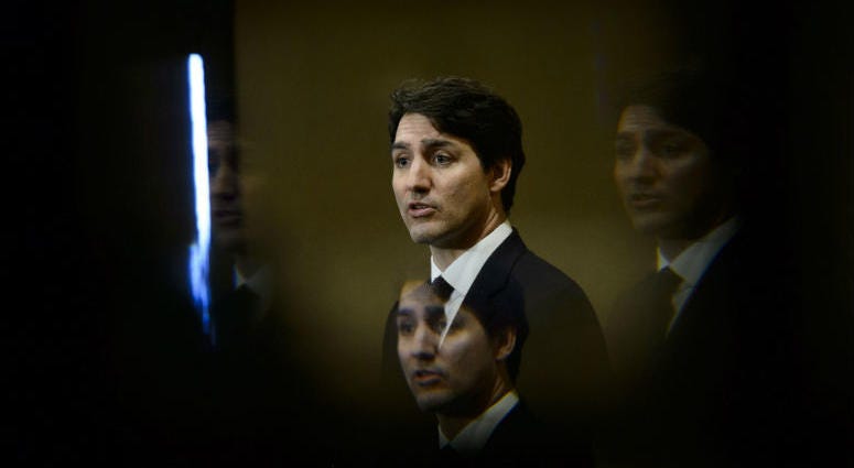 FILE - In this March 8, 2019, file photo, Prime Minister Justin Trudeau is seen through a beveled pane of glass in a door as he takes part in a news conference in Iqaluit, Nunavut, Canada. FILE - In this March 8, 2019, file photo, Prime Minister Justin Trudeau is seen through a beveled pane of glass in a door as he takes part in a news conference in Iqaluit, Nunavut, Canada.