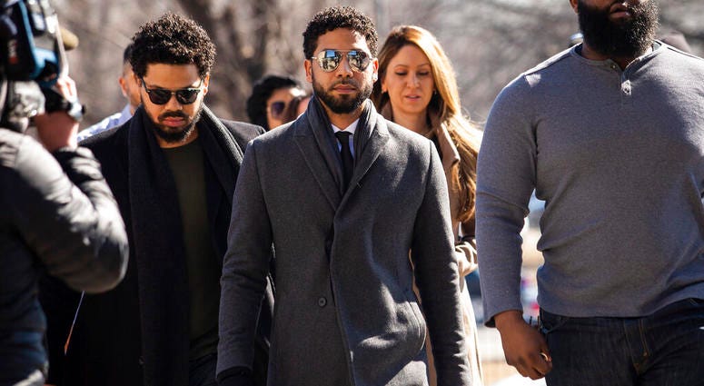 "Empire" actor Jussie Smollett, center, arrives at Leighton Criminal Court Building for a hearing to discuss whether cameras will be allowed in the courtroom during his disorderly conduct case on Tuesday, March 12, 2019, in Chicago. Jussie Smollett