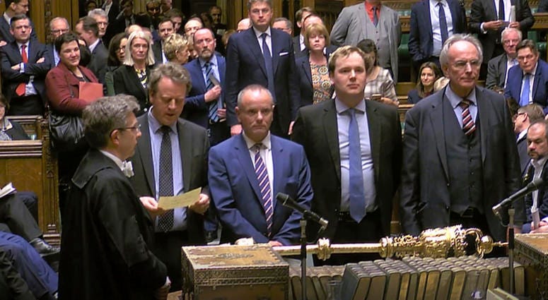 MPs announce the result of the Brexit vote where the motion to allow Britain's Prime Minister Theresa May to request a one-off extension ending June 30 was passed by 412 votes to 202. MPs announce the result of the Brexit vote
