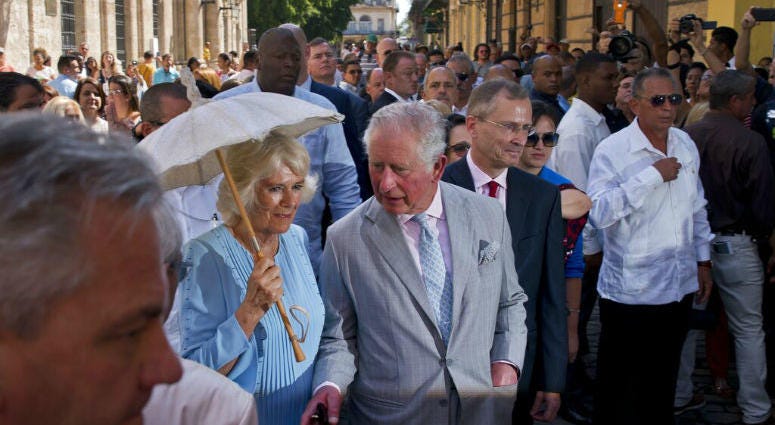 Britain's Prince Charles, the Prince of Wales, center, and his wife Camilla, Duchess of Cornwall, take a guided tour of the historical area of Havana, Cuba, Monday, March 25, 2019. he royal couple began the first official trip to Cuba by the British royal family on Sunday, in a pomp-filled display of disagreement with the Trump administration's strategy of economically isolating the communist island.