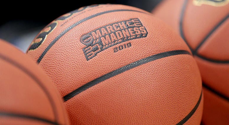 FILE - This Wednesday, March 20, 2019, file photo shows a basketball with March Madness 2019 in a rack before Michigan practice at the NCAA college basketball tournament in Des Moines, Iowa. An Ohio man has made history with a March Madness bracket that's perfect through 48 games on the NCAA.com's "Bracket Challenge," according to the NCAA.