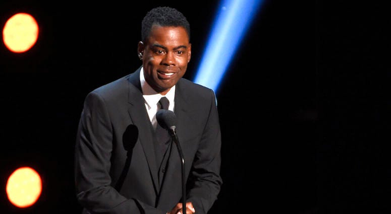 In this March 30, 2019 file photo, Chris Rock presents the award for outstanding comedy series at the 50th annual NAACP Image Awards at the Dolby Theatre in Los Angeles. Chris Rock