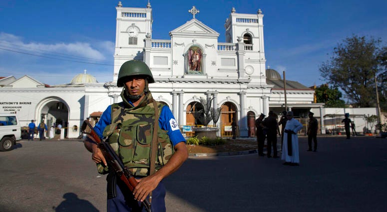 Sri Lankan air force officers and clergy stand outside St. Anthony's Shrine, a day after a blast in Colombo, Sri Lanka, Monday, April 22, 2019. Sri Lankan air force officers and clergy stand outside St. Anthony's Shrine.