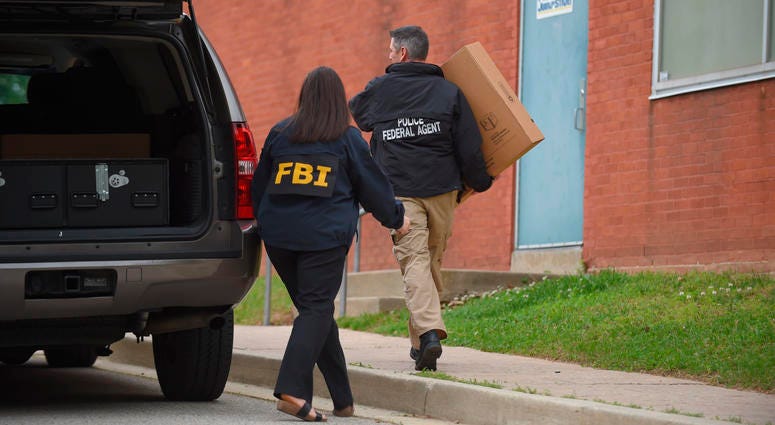 Federal agents arrive at the Maryland Center for Adult Training in Baltimore, April 25, 2019. Agents with the FBI and IRS are gathering evidence inside the two homes of Mayor Catherine Pugh and in City Hall. Baltimore Mayor Catherine Pugh