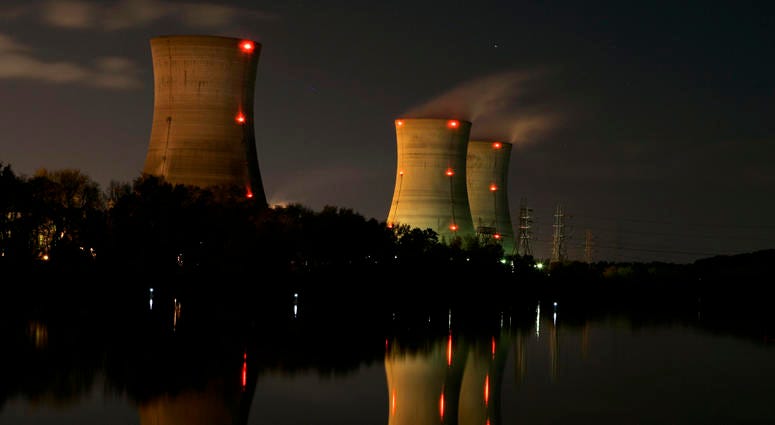 In this Nov. 2, 2006, file photo, cooling towers of the Three Mile Island nuclear power plant are reflected in the Susquehanna River in this image taken with a slow shutter speed in Middletown, Pa. Three Mile Island
