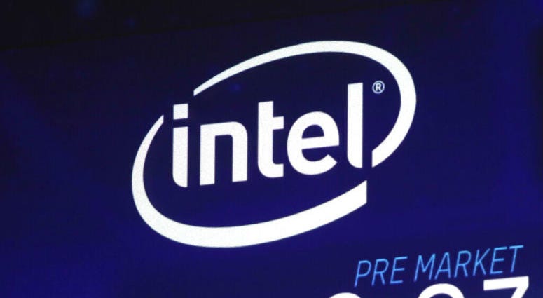 FILE - In this Oct. 3, 2018, file photo the Intel logo appears on a screen at the Nasdaq MarketSite, in New York's Times Square. Intel has revealed another hardware security flaw that could affects millions of machines around the world.