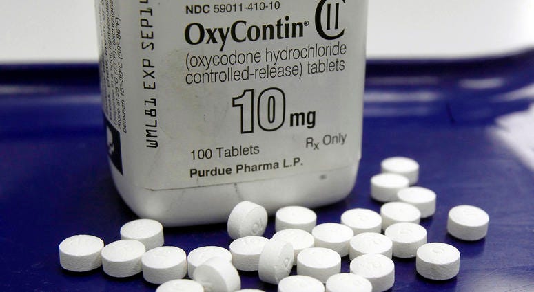 This Feb. 19, 2013, file photo shows OxyContin pills arranged for a photo at a pharmacy, in Montpelier, Vt. OxyContin