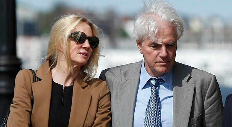 Marcia, left, and Gregory Abbott leave federal court, Wednesday, May 22, 2019, in Boston, where they pleaded guilty to charges in a nationwide college admissions bribery scandal. Marcia, left, and Gregory Abbott