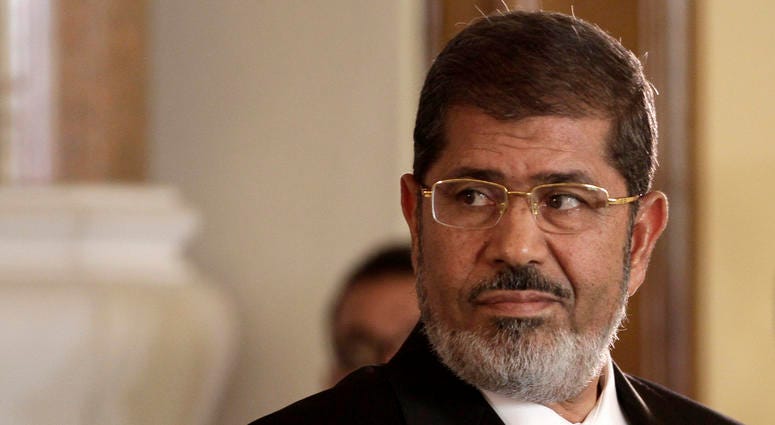 In this July 13, 2012 photo, Egyptian President Mohammed Morsi holds a news conference with Tunisian President Moncef Marzouki, at the Presidential palace in Cairo, Egypt. Egyptian President Mohammed Morsi