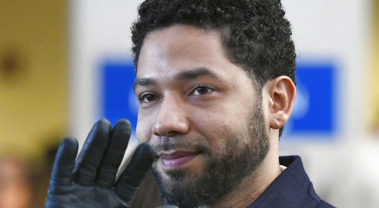 FILE - In this March 26, 2019, file photo, actor Jussie Smollett smiles and waves to supporters before leaving Cook County Court after his charges were dropped in Chicago. A judge has appointed a special prosecutor to investigate the decision by Cook County prosecutors do dismiss all charges against Smollett.