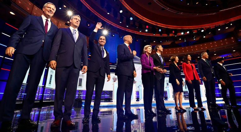From left, Bill de Blasio, Tim Ryan, Julian Castro, Cory Booker, Elizabeth Warren, Beto O’Rourke, Amy Klobuchar, Tulsi Gabbard, Jay Inslee, John Delaney are shown on stage before the start of a Democratic primary debate, Wednesday, June 26, 2019. From left, Bill de Blasio, Tim Ryan, Julian Castro, Cory Booker, Elizabeth Warren, Beto O’Rourke, Amy Klobuchar, Tulsi Gabbard, Jay Inslee, John Delaney are shown on stage before the start of a Democratic primary debate, Wednesday, June 26, 2019.