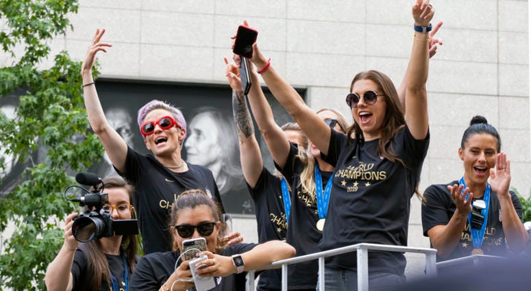 Members of the U.S. women's soccer team, including Megan Rapinoe, rear left, and Alex Morgan, right foreground, stand on a float before being honored with a ticker tape parade along the Canyon of Heroes in New York, Wednesday, July 10, 2019. Members of the U.S. women's soccer team, including Megan Rapinoe, rear left, and Alex Morgan, right foreground, stand on a float before being honored with a ticker tape parade along the Canyon of Heroes in New York, Wednesday, July 10, 2019.