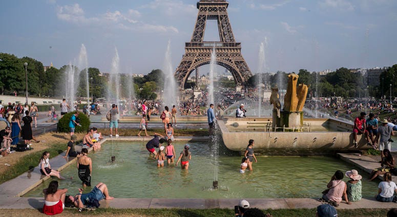 People enjoy the sun and the fountains of the Trocadero gardens in Paris, Thursday July 25, 2019, when a new all-time high temperature of 42.6 degrees Celsius (108.7 F) hit the French capital. People enjoy the sun and the fountains of the Trocadero gardens in Paris, Thursday July 25, 2019, when a new all-time high temperature of 42.6 degrees Celsius (108.7 F) hit the French capital.
