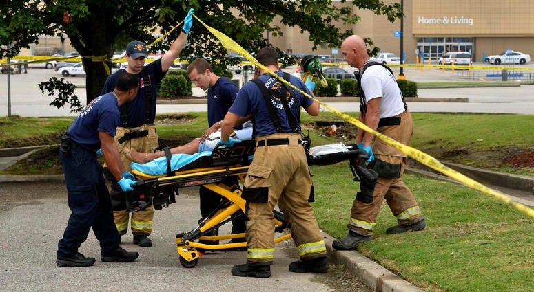 Paramedics offer medical attention after a shooting at a Walmart store Tuesday, July 30, 2019 in Southaven, Miss. Paramedics offer medical attention after a shooting at a Walmart store Tuesday, July 30, 2019 in Southaven, Miss.