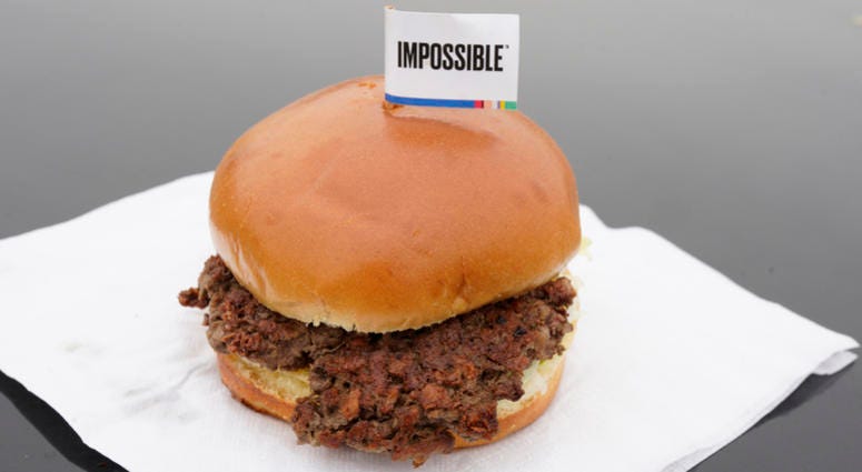 This Jan. 11, 2019, file photo shows the Impossible Burger, a plant-based burger containing wheat protein, coconut oil and potato protein among it's ingredients in Bellevue, Neb. This Jan. 11, 2019, file photo shows the Impossible Burger, a plant-based burger containing wheat protein, coconut oil and potato protein among it's ingredients in Bellevue, Neb.