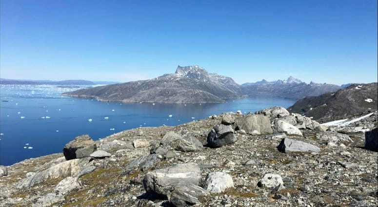 In this image taken on June 15, 2019 small pieces of ice float in the water in Nuuk Fjord, Greenland. In this image taken on June 15, 2019 small pieces of ice float in the water in Nuuk Fjord, Greenland.