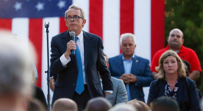 Ohio Gov. Mike DeWine, left, speaks alongside Dayton Mayor Nan Whaley, right, during a vigil at the scene of a mass shooting, Sunday, Aug. 4, 2019, in Dayton, Ohio. Ohio Gov. Mike DeWine, left, speaks alongside Dayton Mayor Nan Whaley, right, during a vigil at the scene of a mass shooting, Sunday, Aug. 4, 2019, in Dayton, Ohio.