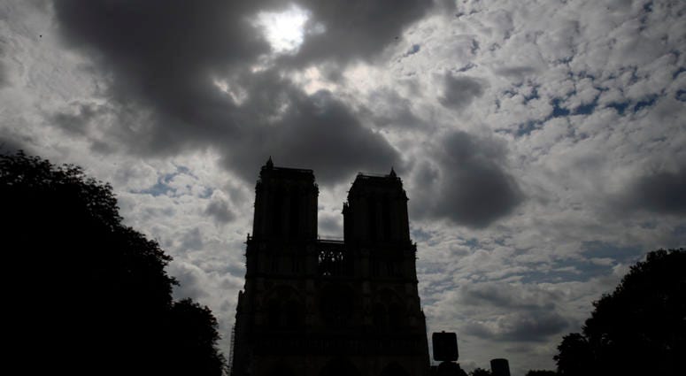 Notre Dame cathedral is silhouetted as environmental groups and unionists attend a news conference to warn against lead particles polluting the air in the area, and ask for a regularly updated chart showing pollution levels in Paris, France. Notre Dame cathedral is silhouetted as environmental groups and unionists attend a news conference to warn against lead particles polluting the air in the area, and ask for a regularly updated chart showing pollution levels in Paris, France.