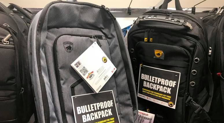 This Thursday, Aug. 8, 2019 photo shows bulletproof backpacks that for sale at an Office Depot store in Evanston, Ill. Bullet-resistant backpacks