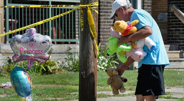 Paul Laughlin, 57, places stuffed animals on Sunday, Aug. 11, 2019 outside a home at 1248 West 11th St. in Erie, Pa., where multiple people died in an early-morning fire. Paul Laughlin, 57, places stuffed animals on Sunday, Aug. 11, 2019 outside a home at 1248 West 11th St. in Erie, Pa., where multiple people died in an early-morning fire.