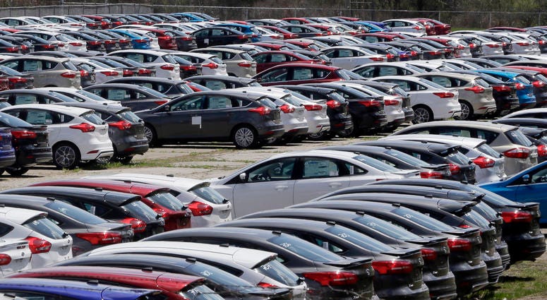 In this May 1, 2015, file photo Ford Focus vehicles are seen on a storage lot in Ypsilanti, Mich. Ford is extending the warranties on about 560,000 small cars to cover a litany of problems with a troubled six-speed automatic transmission. In this May 1, 2015, file photo Ford Focus vehicles are seen on a storage lot in Ypsilanti, Mich. Ford is extending the warranties on about 560,000 small cars to cover a litany of problems with a troubled six-speed automatic transmission.