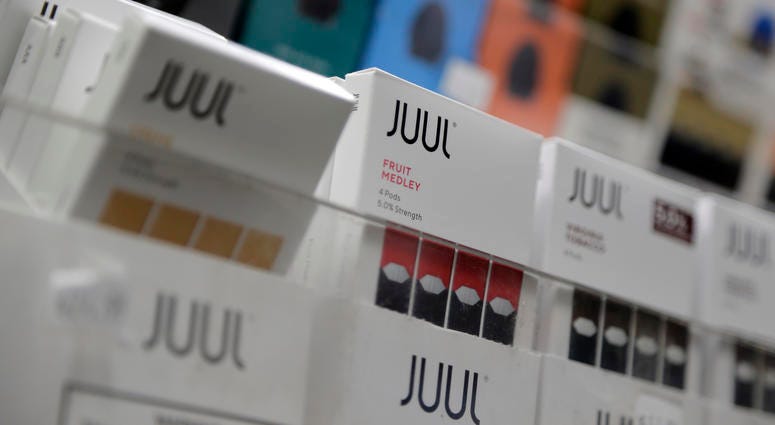 Juul products are displayed at a smoke shop in New York. Juul products are displayed at a smoke shop in New York.