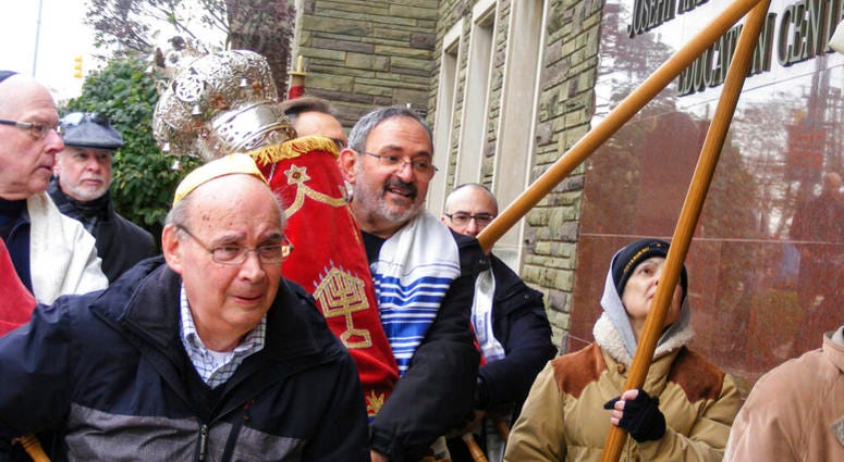 Richard Gottfried carrying a Torah outside the Tree Of Life building in Pittsburgh. Richard Gottfried carrying a Torah outside the Tree Of Life building in Pittsburgh.