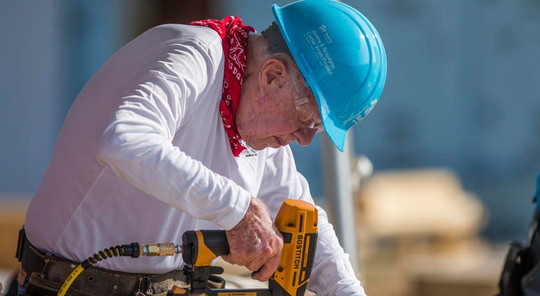 Former President Jimmy Carter works with other volunteers on site during the first day of the weeklong Jimmy & Rosalynn Carter Work Project, their 35th work project with Habitat for Humanity, in Mishawaka, Ind. Former President Jimmy Carter works with other volunteers on site during the first day of the weeklong Jimmy & Rosalynn Carter Work Project, their 35th work project with Habitat for Humanity, in Mishawaka, Ind.