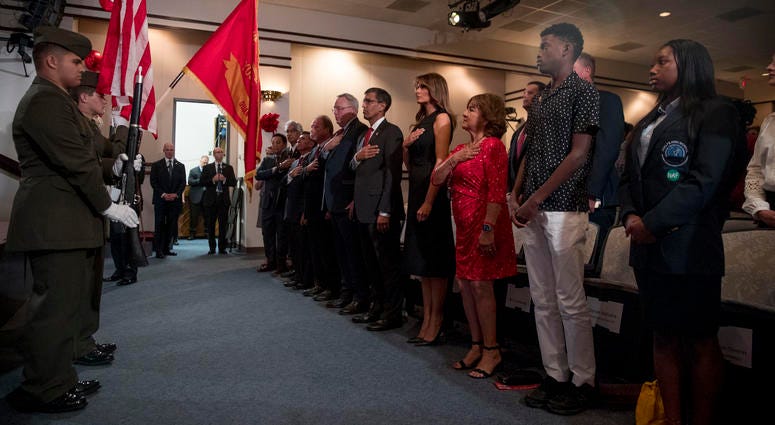First lady Melania Trump, center, and acting DEA Administrator Uttam Dhillon, center left, stands at a Red Ribbon Rally at the Drug Enforcement Agency in Arlington, Va., Monday, Oct. 7, 2019. First lady Melania Trump, center, and acting DEA Administrator Uttam Dhillon, center left, stands at a Red Ribbon Rally at the Drug Enforcement Agency in Arlington, Va., Monday, Oct. 7, 2019.