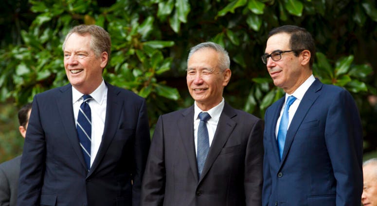 Chinese Vice Premier Liu He accompanied by U.S. Trade Representative Robert Lighthizer, left, and Treasury Secretary Steven Mnuchin, greets the media before a minister-level trade meetings at the Office of the United States Trade Representative in Washing Chinese Vice Premier Liu He accompanied by U.S. Trade Representative Robert Lighthizer, left, and Treasury Secretary Steven Mnuchin, greets the media before a minister-level trade meetings at the Office of the United States Trade Representative in Washing