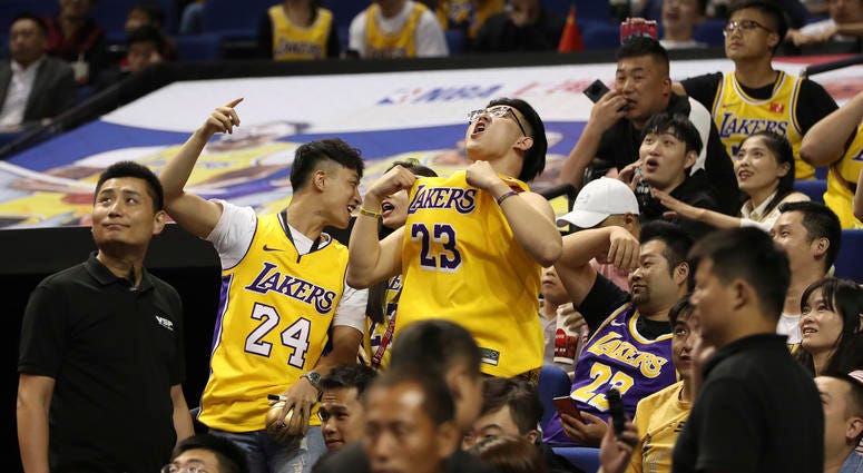 Chinese fans react during a preseason NBA basketball game between the Brooklyn Nets and Los Angeles Lakers at the Mercedes Benz Arena in Shanghai, China, Thursday, Oct. 10, 2019. Chinese fans react during a preseason NBA basketball game between the Brooklyn Nets and Los Angeles Lakers at the Mercedes Benz Arena in Shanghai, China, Thursday, Oct. 10, 2019.