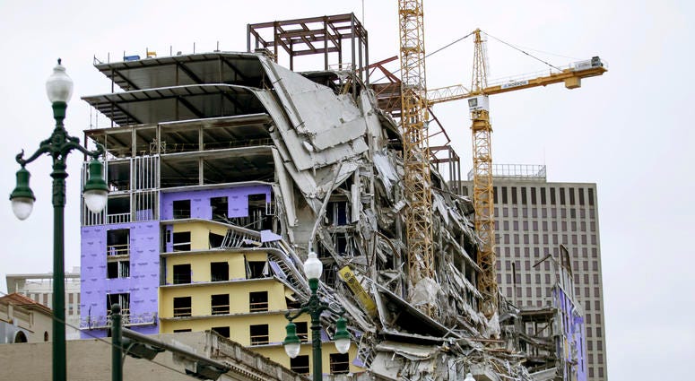A large portion of the Hard Rock Hotel, under construction, suddenly collapsed in New Orleans on Saturday, Oct. 12, 2019. Several construction workers had to run to safety as the hotel came crashing down. Debris hangs on the side of the building after a large portion of a hotel under construction suddenly collapsed in New Orleans on Saturday, Oct. 12, 2019.