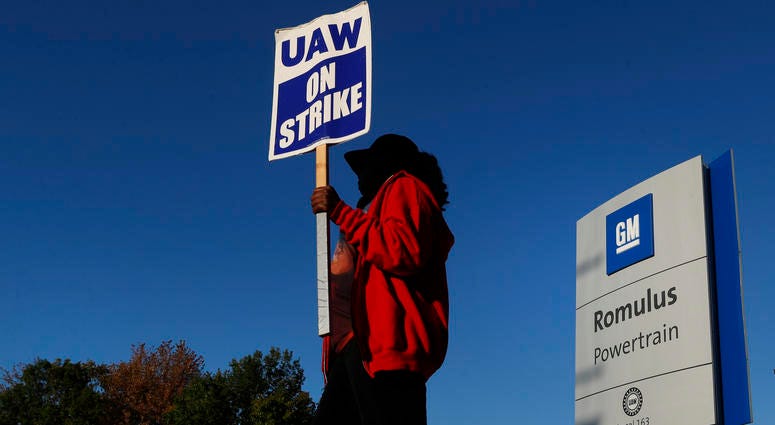 Yolanda Jacobs, a United Auto Workers member, walks the picket line at the General Motors Romulus Powertrain plant in Romulus, Mich. Yolanda Jacobs, a United Auto Workers member, walks the picket line at the General Motors Romulus Powertrain plant in Romulus, Mich.