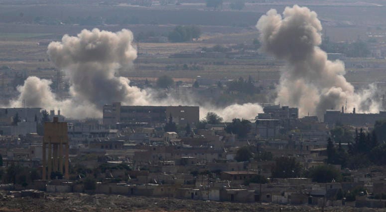 Sanliurfa province, southeastern Turkey, smoke and dust billows from targets in Ras al-Ayn, Syria, caused by bombardment by Turkish forces, Tuesday, Oct. 15, 2019. Sanliurfa province, southeastern Turkey, smoke and dust billows from targets in Ras al-Ayn, Syria, caused by bombardment by Turkish forces, Tuesday, Oct. 15, 2019.