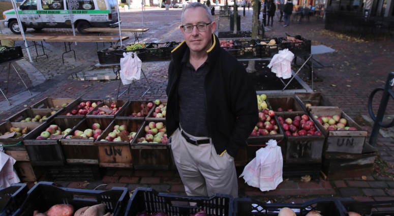 John Gold, self-employed graphics designer, poses at a farmer's market outside his office in Portland, Maine, Wednesday, Oct. 23, 2019. John Gold, self-employed graphics designer, poses at a farmer's market outside his office in Portland, Maine, Wednesday, Oct. 23, 2019.