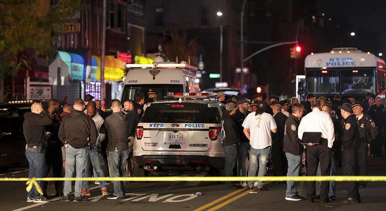 A surge in violent police clashes in recent weeks has left a trail of bodies across the city and stoked tensions between officers and critics who say they have been too quick to use deadly force. New York police and emergency personnel investigate the scene of a shooting at a Brooklyn nail salon. Police say the man who attacked a police officer with a metal chair was shot to death by the officer.