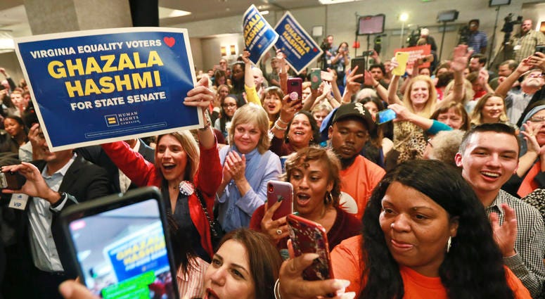 Democratic supporters cheer at their party in Richmond, Va., Tuesday, Nov. 5, 2019. All seats in the Virginia House of Delegates and State Senate are up for election. Democratic supporters cheer at their party in Richmond, Va., Tuesday, Nov. 5, 2019. All seats in the Virginia House of Delegates and State Senate are up for election.