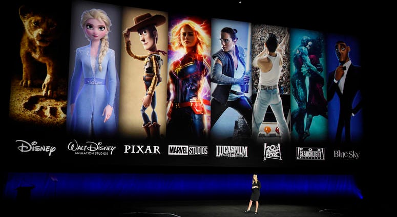 Characters from Disney and Fox movies are displayed behind Cathleen Taff, president of distribution, franchise management, business and audience insight for Walt Disney Studios during the Walt Disney Studios Motion Pictures presentation at CinemaCon 2019. Characters from Disney and Fox movies are displayed behind Cathleen Taff, president of distribution, franchise management, business and audience insight for Walt Disney Studios during the Walt Disney Studios Motion Pictures presentation at CinemaCon 2019.