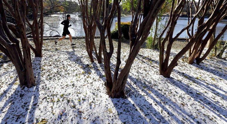 A jogger braves temperatures in the teens as he goes for a run Tuesday, Nov. 12, 2019, in Nashville, Tenn. Snow and icy conditions are snarling traffic and closing or delaying schools in parts of the Northeast and South. A jogger braves temperatures in the teens as he goes for a run Tuesday, Nov. 12, 2019, in Nashville, Tenn. Snow and icy conditions are snarling traffic and closing or delaying schools in parts of the Northeast and South.
