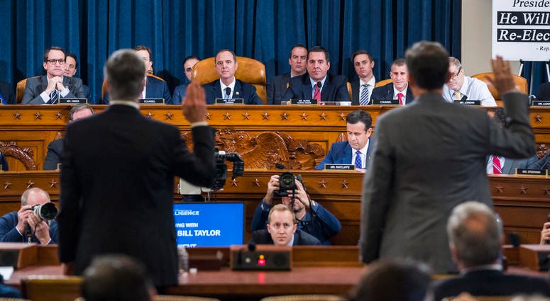 Top U.S. diplomat in Ukraine William Taylor, left, and Career Foreign Service officer George Kent are sworn in prior to testifying before the House Intelligence Committee. Trump impeachment hearing