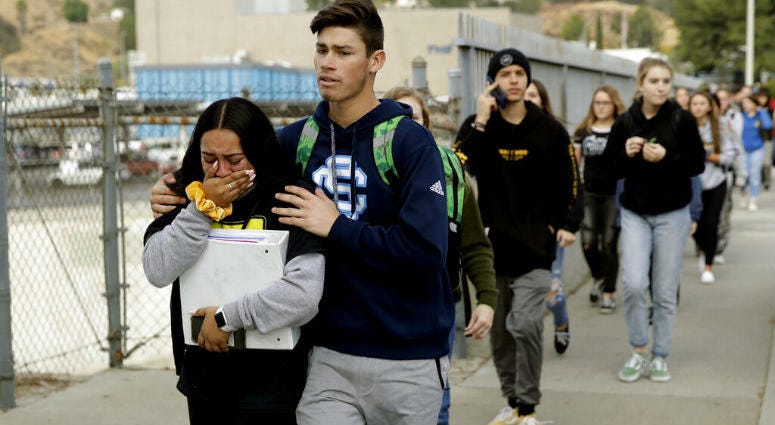 Students are escorted out of Saugus High School after reports of a shooting on Thursday, Nov. 14, 2019, in Santa Clarita, Calif. Students are escorted out of Saugus High School after reports of a shooting on Thursday, Nov. 14, 2019, in Santa Clarita, Calif.