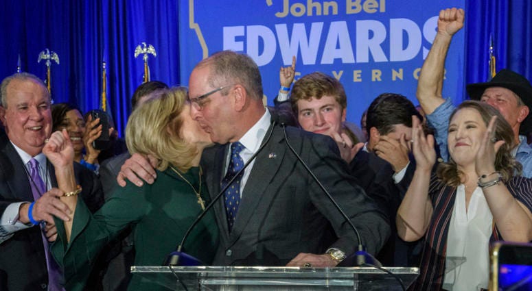 Louisiana Gov. John Bel Edwards celebrates with his wife Donna Edwards as he arrives to address supporters at his election night watch party in Baton Rouge, La., Saturday. Louisiana Gov. John Bel Edwards celebrates with his wife Donna Edwards as he arrives to address supporters at his election night watch party in Baton Rouge, La., Saturday.