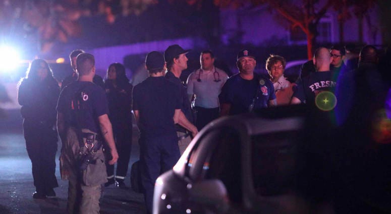 Police and emergency personnel are on the scene of a shooting at a backyard party, Sunday, Nov. 17, 2019, in southeast Fresno, Calif. Police and emergency personnel are on the scene of a shooting at a backyard party, Sunday, Nov. 17, 2019, in southeast Fresno, Calif.