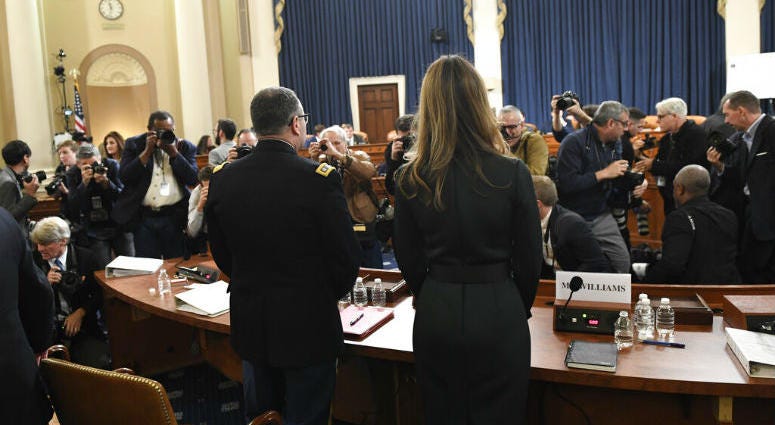 Jennifer Williams, right, an aide to Vice President Mike Pence, and National Security Council aide Lt. Col. Alexander Vindman, stand to take a break as they testify before the House Intelligence Committee on Capitol Hill in Washington, Tuesday. Jennifer Williams, right, an aide to Vice President Mike Pence, and National Security Council aide Lt. Col. Alexander Vindman, stand to take a break.