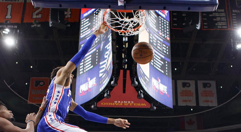 Philadelphia 76ers' Matisse Thybulle, center, dunks the ball with New York Knicks' Dennis Smith Jr., left, defending during the first half of an NBA basketball game, Wednesday, Nov. 20, 2019, in Philadelphia. Philadelphia 76ers' Matisse Thybulle, center, dunks the ball with New York Knicks' Dennis Smith Jr., left, defending during the first half of an NBA basketball game, Wednesday, Nov. 20, 2019, in Philadelphia.