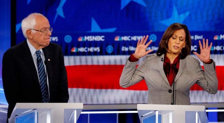 Democratic presidential candidate Sen. Kamala Harris, D-Calif., speaks as Democratic presidential candidate Sen. Bernie Sanders, I-Vt., listens during a Democratic presidential primary debate, Wednesday, Nov. 20, 2019, in Atlanta. Democratic presidential candidate Sen. Kamala Harris, D-Calif., speaks as Democratic presidential candidate Sen. Bernie Sanders, I-Vt., listens during a Democratic presidential primary debate, Wednesday, Nov. 20, 2019, in Atlanta.